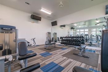 fitness center with free weights at Park at Magnolia apartments
